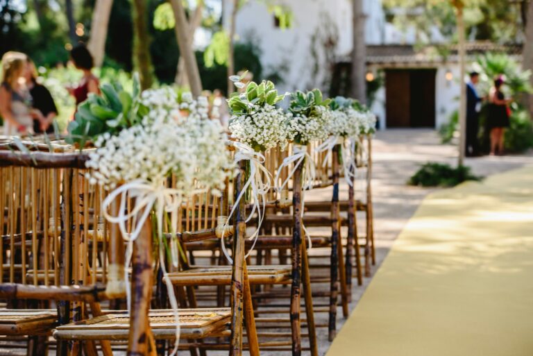 Floral arrangements for empty chairs for a wedding ceremony in spring